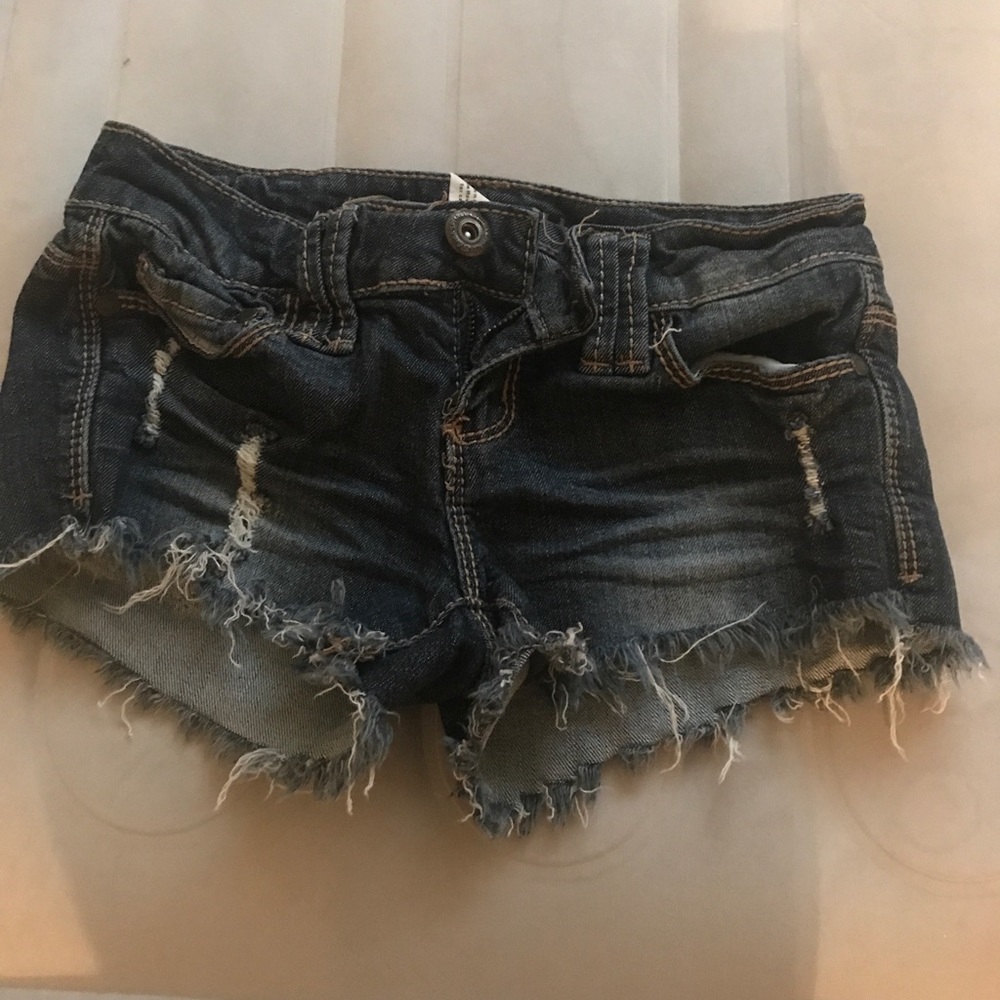 Blue jean shorts with rips